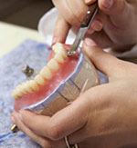 Lab making denture.